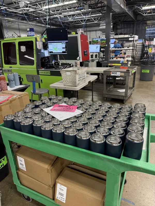 Custom branded product printing — tumblers and promotional merchandise decoration